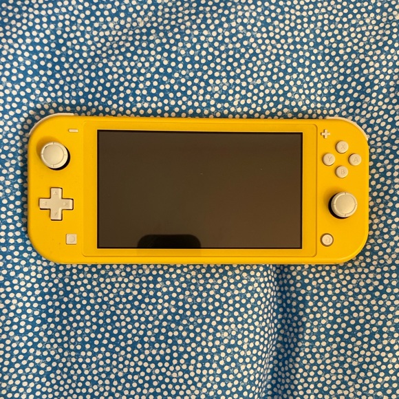 Selling Nintendo switch Lite New with Charger box and two games - Picture 2 of 5